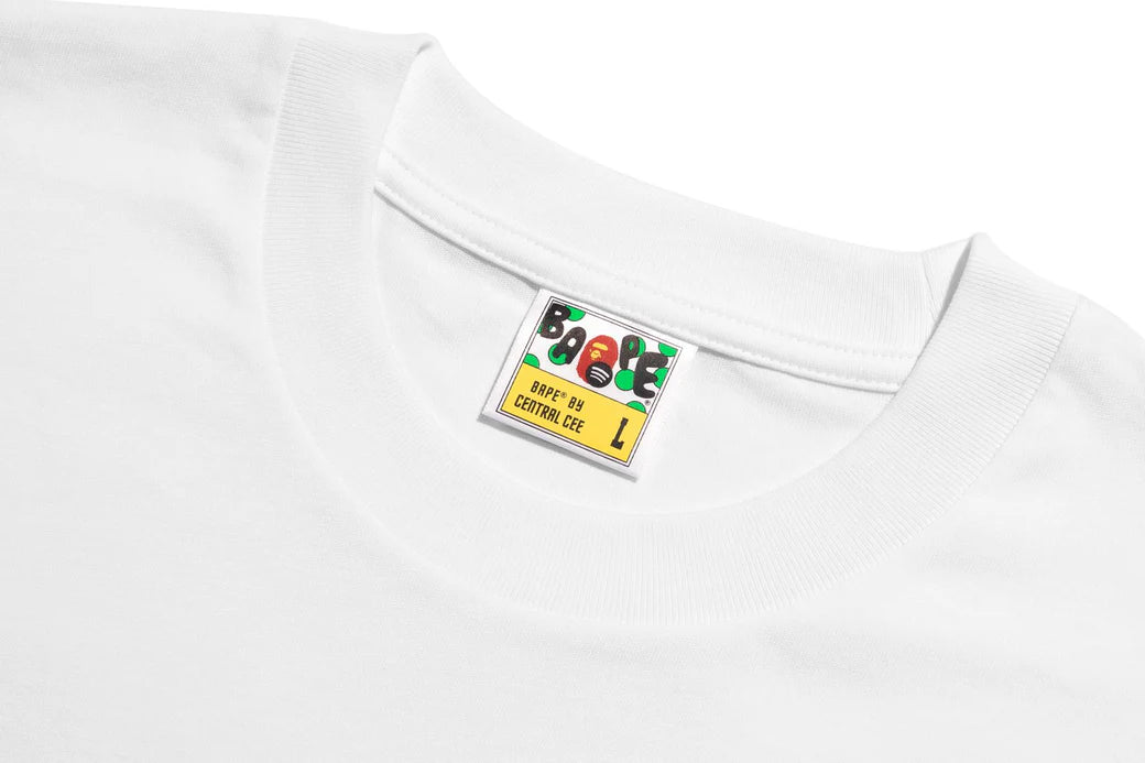 BAPE x Syna World graphic tee featuring a camouflage ape head logo