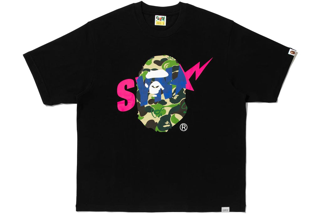 BAPE x Syna World graphic tee featuring a camouflage ape head logo