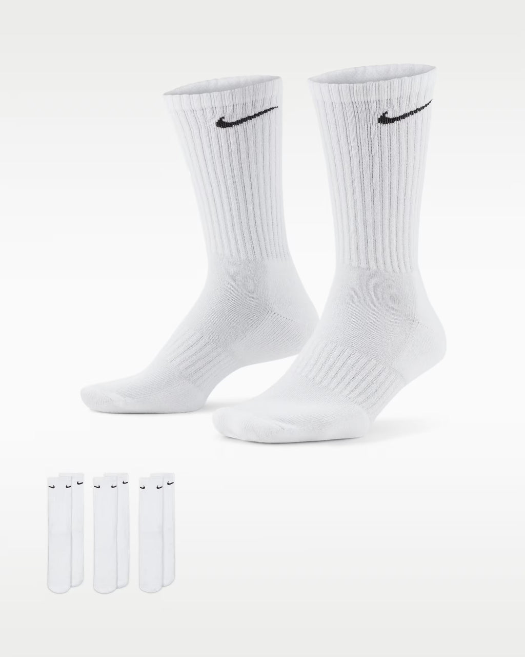 Two pairs of white socks with Nike logo on a white background