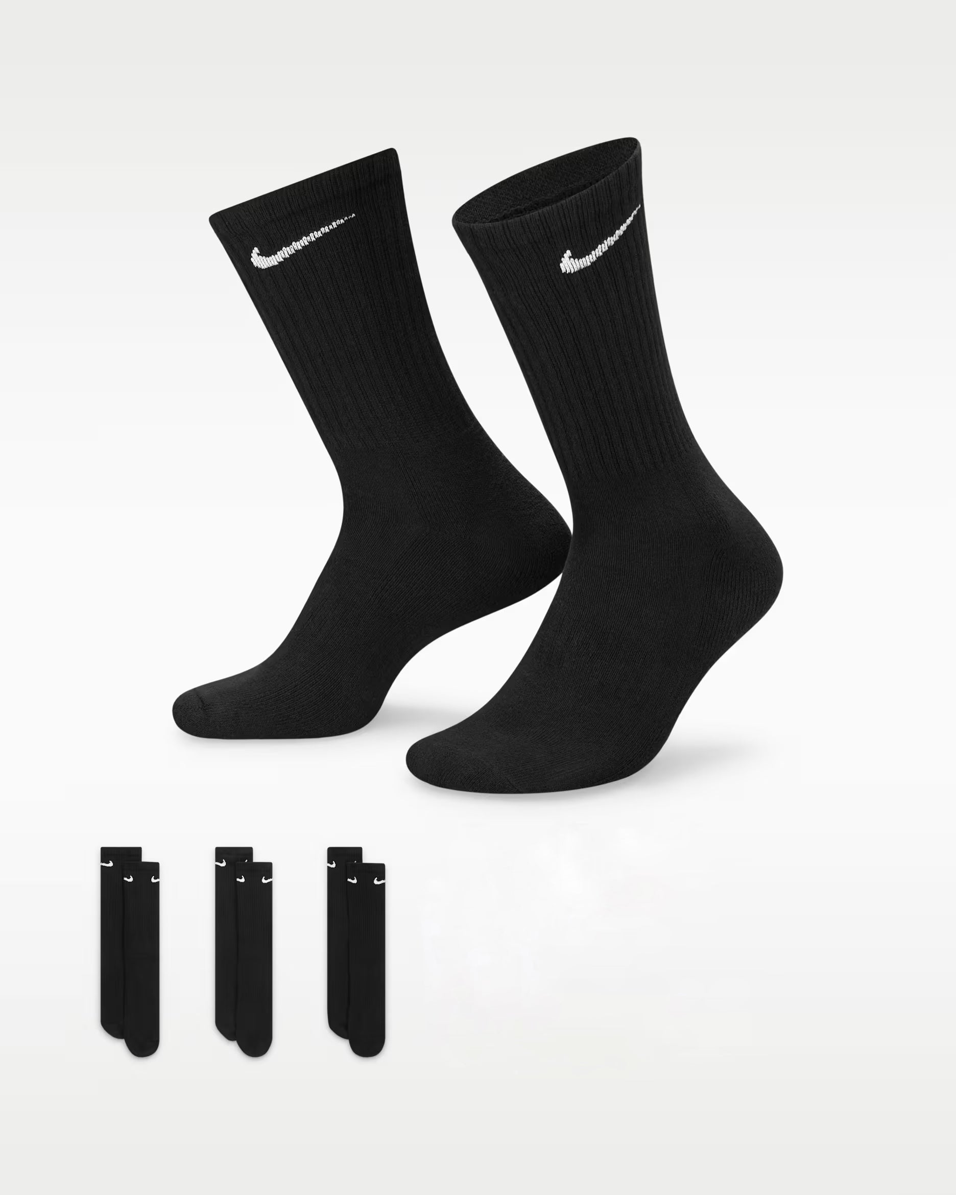 Two pairs of black socks with Nike logo on a white background